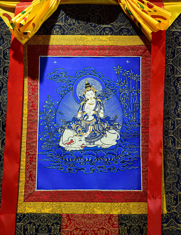 Samantabhadra Bodhisattva Blue Thangka Art - Bodhisattva sits atop a white elephant, holding ritual implements.